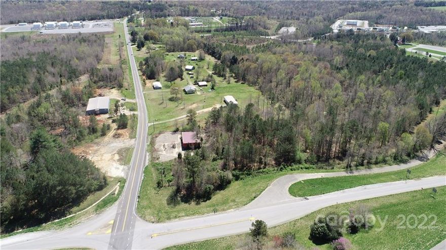 Prime commercial location right off Exit 2 on I-85.  Currently zoned residential, property will need to be rezoned for your needs. The property includes two houses, one manufactured doublewide, an old convenient store, an old pottery shop and a couple of old barns/sheds. HLA includes both houses & doublewide only. One exit away from Two Kings Casino. Perfect location for a gas station, hotel, restaurant, or so much more.