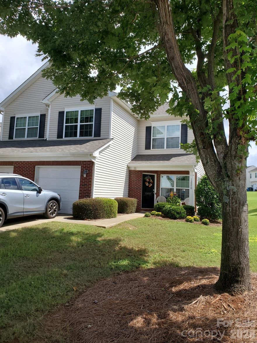 Rare opportunity to own the largest floorplan end-unit townhome in a desirable Pineville community, ideally and conveniently located just 2 miles from Atrium Health Pineville, restaurants, downtown Pineville, and ample shopping! This well-maintained 3-bedroom, 2.5-bath property offers exceptional flexibility—perfect as a primary residence or as a proven income-producing rental.  Move-in ready with numerous updates, including appliances only 1 year old, HVAC approximately 2 years old, fresh interior paint (scheduled), waterproof wood flooring, security system, black-out, insulated top-down, bottom-up custom blinds in all windows, saving tons on electric bills each month! The end-unit location provides added privacy, natural light, and enhanced curb appeal. Located in a well-established neighborhood with convenient access to shopping, dining, and major commuter routes into Charlotte.