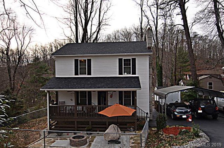 Picture perfect home located in quaint downtown area of Old Fort.  Minutes from 1-40!  This charming 3 bedroom 2.5 bath home is within walking distance of downtown.   The main level features an open floor plan with kitchen, french doors to the back porch, dining, living room and half bath.  Fantastic for entertaining!  The second level has 3 bedrooms, and 2 well appointed bathrooms. Outside are front and back porches, fire pit and an outbuilding for the perfect workshop.  Flowering bushes and small gardens surround this wonderful family home.  This will not last long!