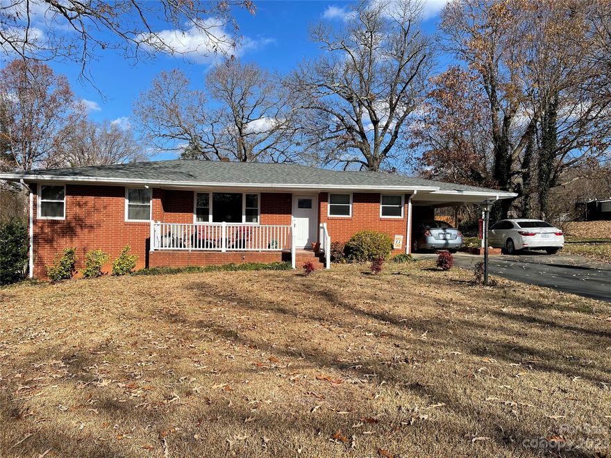 This charming brick ranch with carport is situated on half acre lot.  All the right features have been lovingly updated.  The high end bath improvements include a beautiful step-in shower with seat and glass doors, along with furniture cabinet vanity with granite counter and underhung sink.  You'll find beautiful wood flooring throughout most of the home.  The kitchen boasts generous updated cabinetry, handsome granite counters, lovely tile flooring, broom closet/pantry.  All appliances remain.  This one is in truly move-in condition.