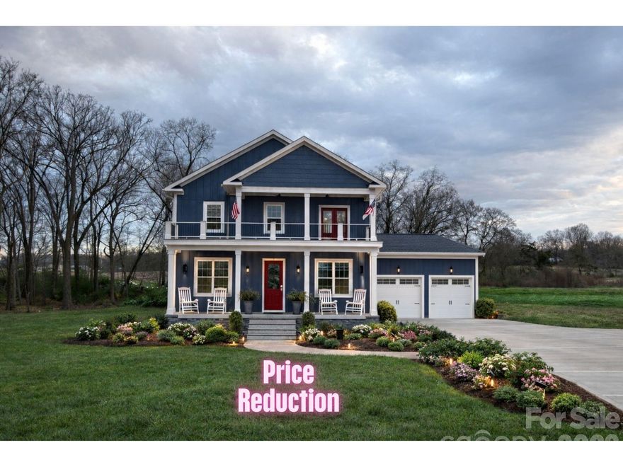 Experience refined Southern living in this exceptional two-story Charleston-style residence, perfectly situated on a serene and private 2+ acre lot. With inviting upper and lower covered porches, along with a spacious screened rear porch, this home seamlessly blends timeless architectural charm with modern luxury.

Now nearing completion, there is still an opportunity to personalize select finishes and make this home uniquely yours. Thoughtfully designed, the floor plan features 4 generously sized bedrooms, 3 full baths, a versatile loft/library with custom built-ins, and an impressive 750 sq. ft. bonus room ready to adapt to your family’s lifestyle.

Exquisite details are found throughout, including extensive crown moldings, hardwood flooring, designer tile in every bath, and custom closets. The gourmet kitchen is equipped with a built-in beverage bar, while the primary suite offers its own private beverage station—perfect for a morning coffee or evening glass of wine.

An oversized garage provides ample space for a workshop, equipment storage, or hobbies. Crafted with high-end custom finishes, this home epitomizes both elegance and function.

Enjoy the natural beauty of the setting, where the gentle sound of a nearby creek after a rainfall and the chorus of birds and crickets create a tranquil backdrop for evenings spent on the expansive screened porch. This week an approx 1,000 square foot outdoor living space will be added at the rear of the house.  This is Southern living at its finest.