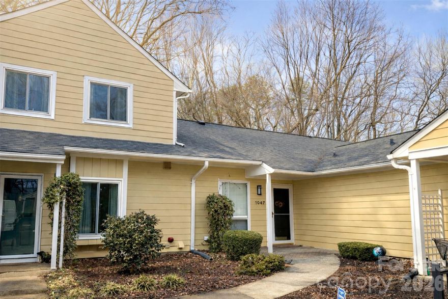 Beautifully refreshed & move-in ready, this one-level corner unit townhome offers low-maintenance living with direct access to the McAlpine Creek Greenway for miles of outdoor enjoyment. Inside, the layout is open & bright with vaulted ceilings, fresh paint, updated light fixtures & durable vinyl plank flooring. The great room feels both spacious and cozy, anchored by a charming painted brick fireplace. The kitchen features granite countertops, stainless appliances & a sunny nook that makes an ideal coffee bar. Enjoy indoor-outdoor living with a large, private, fenced paver patio. Mature trees provide a peaceful backdrop for morning coffee or unwinding in the evening. An outdoor storage unit offers the perfect spot for bikes, gear & more. Refrigerator, washer & dryer are included, saving you from extra expense. HOA dues include exterior maintenance, landscaping, water & cable, making this a low-maintenance option for buyers looking to simplify without sacrificing comfort or convenience. Just minutes to shopping, dining & everyday essentials. Enjoy the rare combination of peaceful greenway access & easy city living.