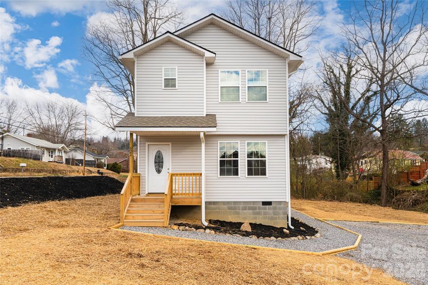 Positioned in Canton, this thoughtfully designed new construction home offers modern living in a walkable setting with long-term upside. Featuring an open-concept floorplan, the main level flows effortlessly from the living area to the kitchen, highlighted by a beautiful tile backsplash, island with breakfast bar seating, and clean contemporary finishes. Covered front porch and back deck perfect for gathering with friends and family. The two-story layout provides a smart separation of space, with all bedrooms located upstairs, creating privacy and functionality while maximizing the main level’s living and gathering areas. Quality craftsmanship, efficient design, and modern materials make this home move-in ready and easy to maintain. Beyond the home itself, the location tells a compelling story. Downtown Canton is entering a period of reinvention, transitioning from its mill-driven past toward a more diversified future that includes residential, commercial, and community-focused development. This evolution is already bringing new energy, infrastructure investment, and opportunity to the area, making well-located homes like this especially attractive for buyers seeking both lifestyle and value. Walk to local shops, restaurants, parks, and community amenities while enjoying proximity to Asheville and the outdoor recreation Western North Carolina is known for. As demand continues to grow for affordable, walkable mountain towns with strong identity, Canton stands out as a place where thoughtful buyers can position themselves early. Whether you’re looking for a primary residence, long-term hold, or strategic investment, this home offers quality construction, a prime downtown location, and the opportunity to be part of Canton’s next chapter.