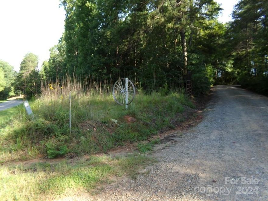 Over 200 feet paved frontage on State Line Rd just off US 221.  Marvy's Trail is the western boundary.  Nice wooded cover offers private homesite.  Conveniently located just north of Chesnee SC or about 20 min south of Rutherfordton NC.