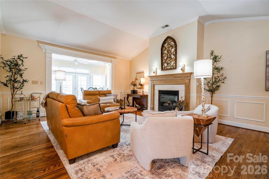 Located in The Columns Community this beautiful end unit 2 bedrooms 2 full bath offers easy living on one floor.  New Roof, Refinished and Stained Hardwood Floors, Fresh Paint.  Level entrance into the large two car garage with ample attic storage.  The open floor plan flows from the kitchen to the bright sitting room and private back deck. Updated primary en-suite with new vanity and walk in tile shower with glass door.  The second bedroom is oversized and has been used as a craft space/office and guest room as needed.  New landscaping has been added to the front entrance.  The Columns Townhomes are located adjacent to Cleveland Country Club, minutes to restaurants, shopping, hospital and schools.  Move in ready.  Home is staged. Furniture and decor are available for purchase.