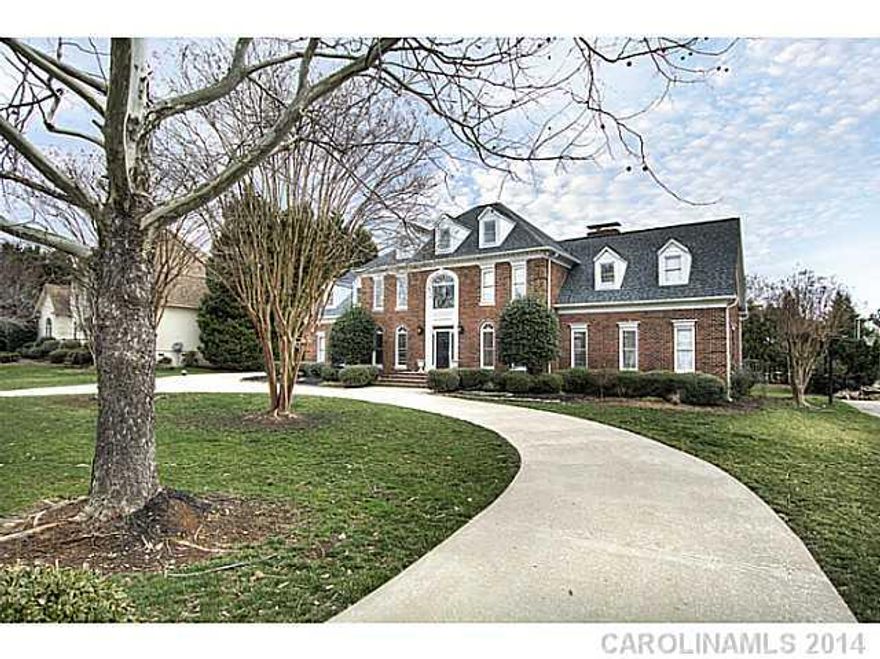 Enjoy elegant country club living in picturesque estate home on golf course. Custom home has beautiful details throughout incl crown molding, built-ins, gourmet kitchen w/induction cooktop & dbl pantries. Mstr BR perfect for relaxing w/cozy sitting rm w/fpl. Lrg GR features French doors leading to deck and screened porch overlooking flat landscaped backyard..