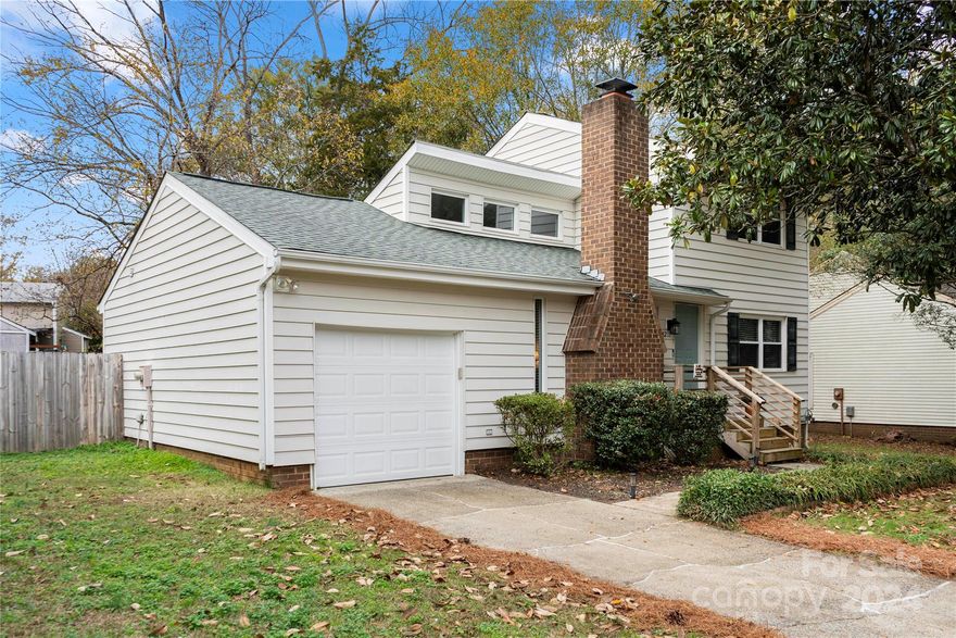 Charming home in South Charlotte close to the greenway, shopping and restaurants. Open floorplan with primary bedroom on main. All new paint and carpet installed 11/11/24. Kitchen has shiplap detailing with open shelving and painted cabinets. Real hardwood floors and vaulted ceilings in living room. Attached one car garage off of laundry room. Primary bathroom was updated a few years ago and still looks new. Newer back deck to entertain with a huge fenced in backyard with lots of room to spread out. Park Ridge is a hidden gem neighborhood, with easy access around Charlotte.