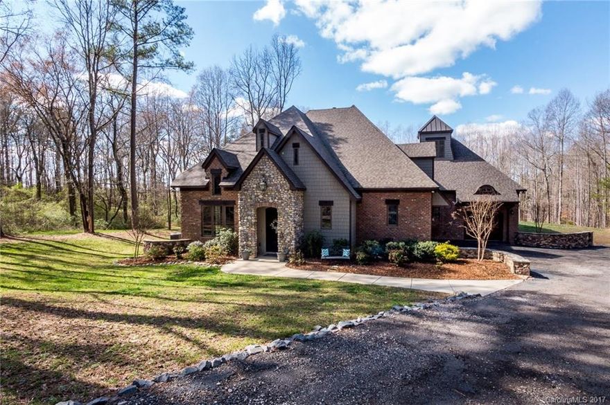 Live in LUXURY the SMART way! Nestled in an equestrian community w/ plantation-size homesites of 5-15+ acres, this European style full brick home is rich w/ exquisite finishes: rustic oak beam, coffered ceiling, hand forged iron entrance door, stone fireplace, and solid black walnut mantel. Dream kitchen has marble counters, professional energy star appliances, solid maple cabinets & walk-in pantry. Energy efficient w/ spray foam insulation & low E windows. Prewired for full automation!