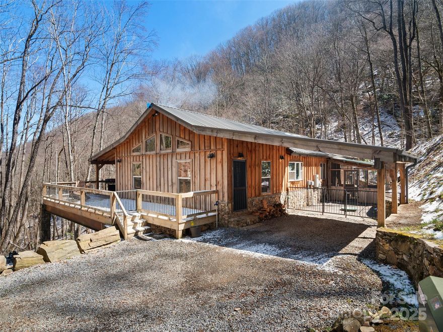 High elevated 143+- acres w/rustic ranch-style two-bedroom, two-bath home with over 1,650 finished square feet, featuring custom finishes throughout. This magnificent home is perfectly placed between two roaring creeks that converge just off the expansive covered wraparound deck, where you'll find a bold outdoor fireplace creating a serene and inviting setting. Inside, the open floor plan boasts soaring vaulted ceilings, enhancing the spacious feel of the great room, which includes a stunning floor-to-ceiling stone fireplace. The dining area seamlessly connects to the custom kitchen, complete with an island breakfast bar, abundant cabinetry,and a large pantry for ample storage. The primary suite offers a cozy gas fireplace, a walk-in closet, and a luxurious bath featuring a stone walk-in shower. The second bedroom is equally inviting, and the home’s thoughtful design blends rustic charm with modern comfort. Enjoy breathtaking views, the sound of rushing water, and the beauty of nature.