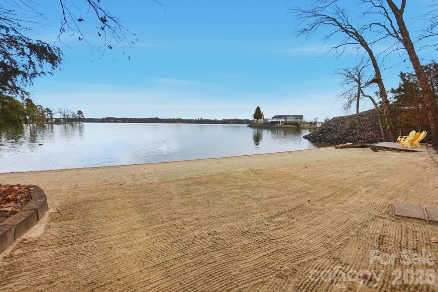 Custom waterfront home on the main channel of Lake Wylie! Enjoy the pristine shoreline with a rare natural sandy beach and firepit, perfect for lakeside entertaining. This property is beautifully landscaped with stone walkways, outdoor cooking station, and multiple picnic areas, all designed to maximize outdoor living. Inside, the home features a primary suite on the main level, formal dining room, and a two-story great room with a stone fireplace. Large windows frame the space while a glass door opens onto a covered porch stretching the length of the home, complete with half-glass panels for unobstructed panoramic lake views. The large unfinished basement offers endless potential, including a garage, recreation area, and abundant storage. Mature trees provide exceptional privacy, and multiple outbuildings offer ideal storage for gardening equipment, lake toys, or hobbies. Whether launching a kayak, gathering around a firepit by the shore, or simply taking in the view from your porch, life on the water invites you to slow down, entertain effortlessly, and enjoy every season! With limited availability and timeless demand, owning on the water isn’t just a lifestyle choice—it’s a smart investment in how you live!