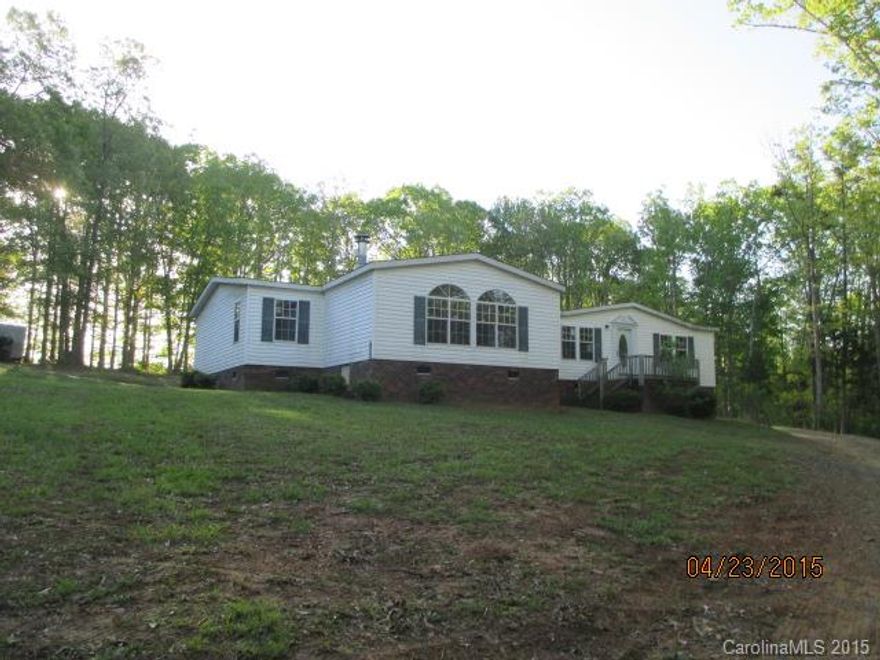 4 bedrooms and 2 baths manufactured double wide home that sits on 1.04 acre nice large lot features kitchen, living room, bath with garden tub, spacious rooms and neutral colors throughout. Home includes deck and 2 car detached garage. No HVAC and Water Heater. No bathtub in the guest bathroom.
