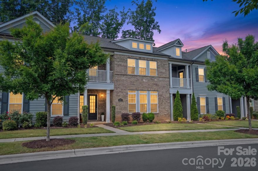 Luxury townhome living in the highly sought-after Providence Village, just steps from the vibrant shops and dining of Waverly. Built by John Wieland Homes, this beautifully designed 3-bedroom, 3.5-bath residence offers nearly 2,500 square feet of thoughtfully curated living space, combining elegance, comfort, and unmatched convenience in one of South Charlotte’s premier locations.

Perfectly positioned for privacy, the home backs to a natural buffer for added seclusion, offering no rear neighbors and a peaceful, private backdrop. A true standout, it lives like an end-unit residence with abundant natural light streaming through expansive windows and glass doors, enhancing its open, airy feel. The main level showcases an inviting open-concept layout featuring a chef’s kitchen with stacked cabinetry, quartz countertops, stainless steel appliances, gas cooktop with designer range hood, a large center island, elegant backsplash, walk-in pantry, and included refrigerator. The kitchen flows seamlessly into the dining and great room, where coffered ceilings, custom lighting, built-ins, and a cozy gas fireplace with brick surround and wood mantel create a warm yet refined atmosphere.

Upstairs, all three spacious bedrooms feature private en-suite baths and walk-in closets. The primary suite is a true retreat with dual walk-in closets (including a dressing closet), a sitting area and study/flex space, and a spa-inspired bath with an oversized freestanding tub, frameless glass shower, dual vanities, designer tile, and upscale lighting. A private covered balcony adds an elevated touch of relaxation and charm.

Additional highlights include engineered hardwood flooring throughout main living areas, a two-car garage, turned staircase, upper-level laundry with sink, thoughtful smart design details throughout, and exceptional storage. Enjoy the ease of low-maintenance living with HOA-covered lawn care, exterior maintenance, trash, cable, and internet. Community amenities include sidewalks, a dog park, garden space, and alley-load garage access.

Located in an award-winning school district and just minutes to I-485, this home offers the perfect blend of luxury, lifestyle, and location. Walk to Waverly, dine, shop, and enjoy everything this exceptional community has to offer—an easy walk from your door. A rare opportunity in one of South Charlotte’s most desirable townhome communities. IMPORTANT NOTE REGARDING MIDDLE SCHOOL PLACEMENT: Beginning with the 2026–2027 school year, the middle school program (grades 6–8) will transition to a full magnet lottery-based admission process through CMS. If a student is not accepted through the lottery for the school year, the assigned middle school will be Jay M. Robinson.