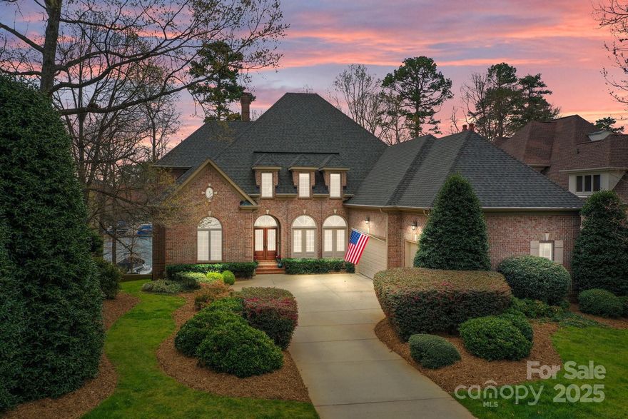 Welcome to 16624 Flying Jib; a luxurious waterfront home in The Peninsula, overlooking a well-loved cove. Its deep water, NO WAKE ZONE is perfect for swimming, paddle boarding & kayaking.  
Step inside to the sun-washed living areas which create a seamless flow for both intimate & large gatherings. Chef’s kitchen opens to the great room & features custom cherry cabinetry w/large prep island. Main level primary suite offers lake views and spacious spa bath. Upper level includes 3 oversized bedrooms, & extraordinary amounts of walk-in storage. Lower level offers a secondary living space w/ kitchen/wet bar, large bedroom suite w/lake views, family room, game room, exercise area & a large separate area for lake toys; accessed from the interior and exterior. Ideal for guests, the lower level is versatile as well as functional. Oversized 3 car garage is a car aficionado's dream! Rear yard is fenced w/mature landscaping, & leads to a fabulous private dock. This home is simply fabulous.