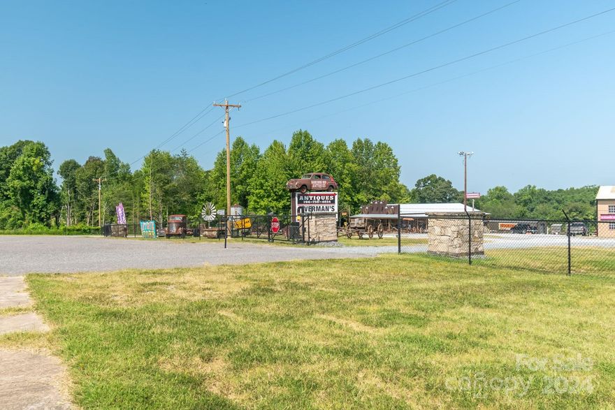 Welcome to an Incredible business opportunity! This property has everything you need to run one or more businesses with the Luxury of having a small apartment in the back of the gorgeous newly built custom shop. Boasting 4.28 acres in a prime location (E Dixon) the possibilities are endless. Inside of a beautiful double ended electric and stone fence lies an office building, huge workshop equipped with a wood burning stove, ventilation and electricity, two covered carports, a detached garage, a large storage unit and a stunning one of a kind custom built store. The property has a security system equipped with cameras and everything you need to move in and run your businesses. There was no detail missed with design when procuring this compound. The property comes with a double sided billboard that can be rented out for even more income.Hundreds of vehicles pass by per hour making this the premier location. This listing is doubled in the MLS(#4182616 under residential)