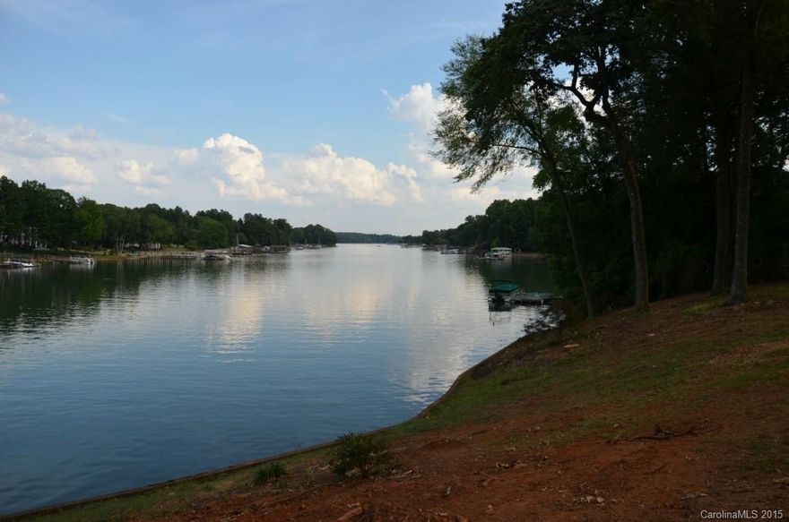 Amazing Waterfront opportunity! This lot is .71acres and features 126' of shoreline, beautiful mature hardwoods and a gentle walk to the water. A beautiful build site that has long rang water views, can support a 4 bdr room home and has room for a pool! Truly a must see and own. Tax value is of original parcel as well as legal description. Property has been surveyed and 4 bdr perk permit and Dock permit have been approved. 3.5 miles to ext35 &I77