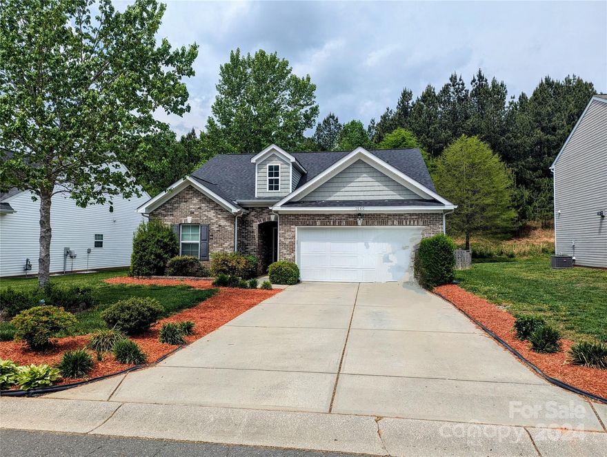 Welcome to your dream home in the heart of Lake Wylie in desirable Mill Creek Falls. This spacious and inviting 4-bedroom, 3-bathroom property boasts a unique feature – no rear neighbors, just serene green space. Enjoy the perfect blend of tranquility and community engagement with something for everyone. Step inside to discover a thoughtfully designed layout that includes a main-level primary bedroom and an upstairs retreat complete with a bedroom, full bath, and bonus area. Fenced backyard and oversized patio with a fire pit, perfect for entertaining or simply relaxing under the stars. With the perfect balance between privacy and community, you'll find amenities, including a pool, playground, walking trails, tennis courts, frisbee golf, ponds, and a clubhouse. Indulge in the vibrant atmosphere of food trucks during the summer months. Don’t miss out on the opportunity to make this property your new home. Low SC taxes, Clover Schools, and close to everything.