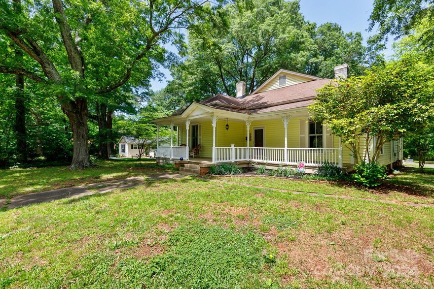 Step into the past & embrace a piece of history with this charming historic home nestled in the heart of York. This home exudes the southern charm with a spacious front porch & sprawling deck. The main floor welcomes you with a large living room, formal dining room & spacious kitchen with a cozy breakfast nook. 3 downstairs bedrooms, including a luxurious primary suite with new carpet, a vast walk-in closet & updated bathroom. Original hardwood floors grace one of the bedrooms, adding a touch of character. Ascend upstairs to discover 2 additional bedrooms & a bonus room, perfect for an office, playroom, or whatever your imagination desires. Outside you'll find a sturdy metal 2-car carport with attached storage. With this 0.52 ac lot of flat, expansive yard space, the possibilities are endless. Whether you move right in or are eager to infuse your personal style, this home offers both charm & potential at an unbeatable value. Similar updated properties command prices upwards of $500K.