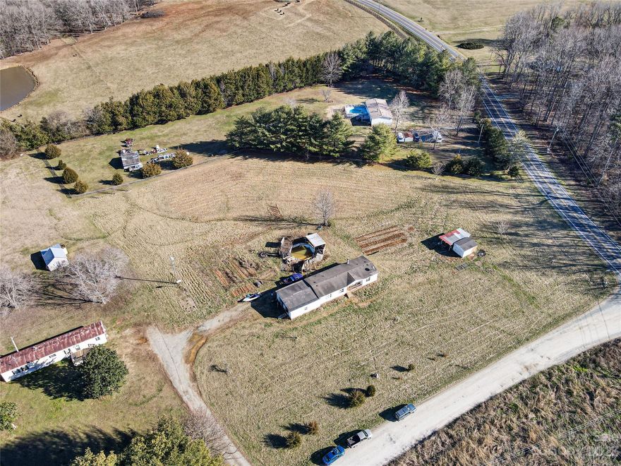 Attention Investors and Developers! Incredible opportunity to acquire 2.71 acres of prime land at 8436 Wild Rose Drive #A in Liberty, North Carolina. The value is primarily in the land, as the existing trailer on the property is not livable and in need of significant renovation or removal. This expansive parcel offers ample space for potential development, making it an ideal investment opportunity. Explore the possibilities and envision the potential for new construction or other ventures. Don't miss out on this chance to make your mark in a rapidly evolving area. Contact us today for more information and to schedule a viewing!