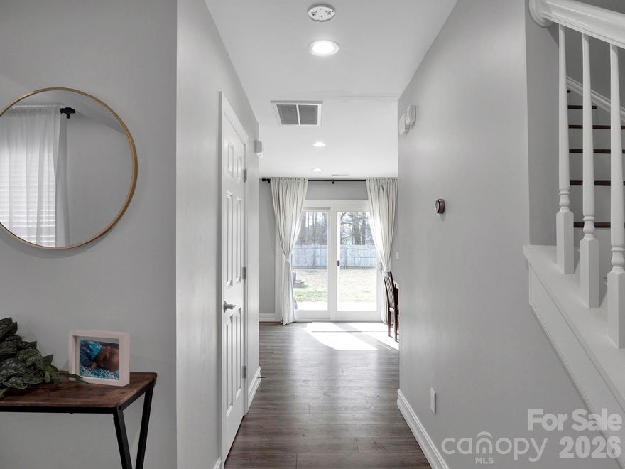 Welcome home to this beautifully maintained 3-bedroom, 2.5-bath residence nestled in an established community. Featuring durable vinyl siding and a spacious 2-car garage, this home offers both comfort and convenience. Inside, a formal dining room sets the stage for memorable gatherings, while the open layout provides plenty of space for entertaining family and friends. Relax in the inviting living area with a cozy gas log fireplace, perfect for cooler evenings. The primary suite is a true retreat, complete with a large garden tub and a separate shower. Step outside to enjoy the fully fenced backyard—ideal for pets or play—along with a rear patio perfect for outdoor dining and relaxing. Additional highlights include a brand-new AC installed in 2025, ensuring year-round comfort, new stove and water heater in 2024. This home blends timeless charm with modern updates and is ready for you to move in and enjoy.