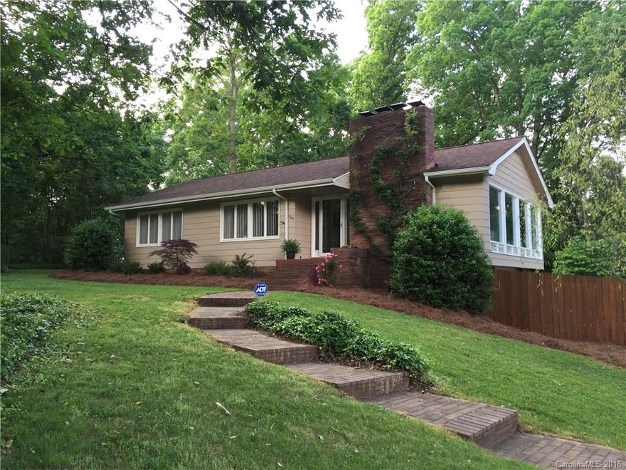 Beautiful home in desirable Forest Hills. Hardwood floors throughout main level living areas and bedrooms. Spacious kitchen includes granite countertops, stainless appliances, and eat-in breakfast bar with beverage refrigerator.  Separate master with its own bath. Gas logs in LR and basement. This home is made for entertaining family and friends. You will love using your downstairs bar and TV room. Outdoor spaces include a large fenced back yard and two patios for weekend and evening cookouts.