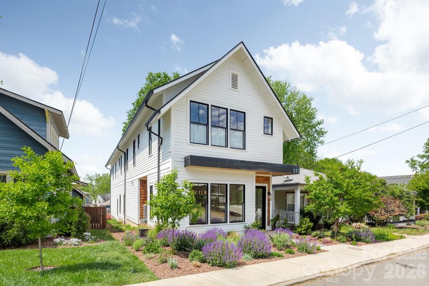 Modern, Charming, and Sleek are words that describe 313 Solomon Street in Charlotte’s Biddleville Neighborhood! Developed and Built by MBH Construction, a local Builder known for unique, custom homes built with exceptional materials, precision and care, this modern craftsman home is waiting for you to come make it your new in-town pad. Step inside to an open plan with spacious, natural light-filled rooms, tall ceilings and premium finishes. Fresh and stylish interior details include site-finished matte hardwood floors, extensive trim and door package, designer tile/hardware/lighting/plumbing fixtures, custom kitchen and baths, upgraded appliances including 42” refrigerator and 36” gas range, and much more. The morning room off the kitchen is a perfect spot to enjoy the fireplace while sipping on your favorite cup of joe. For evenings, the sunken living room includes a wet bar and makes a perfect conversation pit and lounge space. An upstairs bonus room / loft can be your fun in-formal hangout area prior to retreating into your oversized primary suite. For all you outdoor lovers and wheel enthusiasts, the oversized garage is a dream and makes for a chill outdoor room while retaining plenty of space for your toys. Outside, this home has curb appeal galore with numerous architectural details including cedar accents, exposed soffits and rafter-tails, and heavy window and door moldings. This property is landscaped from front to back and has beautiful flowering bushes and pollinator gardens. Even more: electric car charging outlet, spray foam insulation (roof deck/exterior walls) and floored attic. This unique, special home does not disappoint. Schedule a tour TODAY!