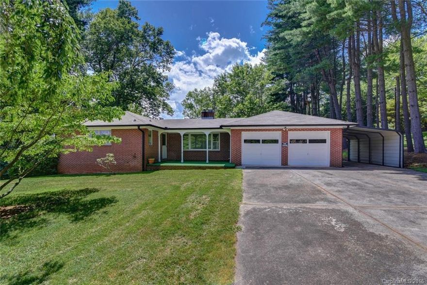 Quality brick rancher, just minutes off Patton Ave and I-40! Come see this home and all its great new features, including new roof and refinished hardwood floors. You will really enjoy the unique built ins and wood burning fireplace, as well as a two car garage & carport for parking, and unfinished basement for storage.  You will also love the large, level yard and outdoor entertaining opportunities. This property is zoned for commercial and residential, so the possibilities are endless.