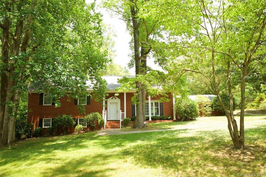 Large Home on nearly 1 acre lot. Quiet neighborhood. Mature Trees. Close to Shopping, I-485, and Parks. Two-car attached Garage. Screened Porch. New paint, refinished hardwood floors, New Counter Tops, Two Living Rooms. 5th Bedroom/ bonus room. 4 Full Baths. Lots of Room and yard to play!