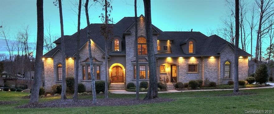 Absolutely Stunning Waterfront Home w/ European influence! Master on main. Gorgeous kitchen. Finished basement w/ 2nd Master, full custom oak bar, large wine cellar, office. Spacious secondary bedrooms. Beautifully landscaped w/ in-ground pool & 13,000 gallon Koi pond. State-of-the-art electronic systems. Incredible attention to detail throughout home. Award-winning Clover schools & low SC taxes.