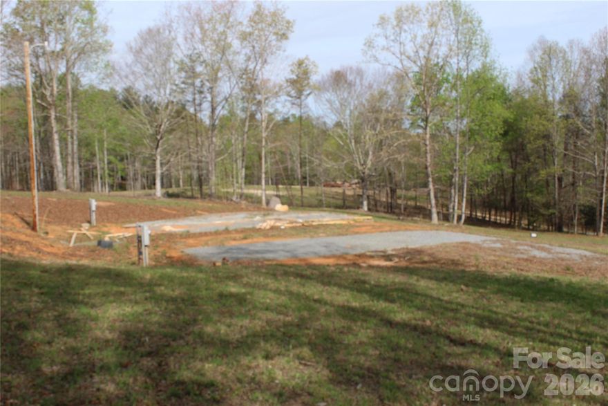 A 1.84-acre parcel of vacant land situated in a quiet country setting, offering a blend of open space and practical improvements. The property is already equipped with two electrical panels, providing flexibility for future construction, multiple structures, or workshop use. A permitted 4-bedroom septic system is in place, along with a private well, making the land ready for residential development with essential utilities already established. There is a 12 x 20 storage shed for tools or lawn equipment. Various fruit trees. With no restrictions, the property allows for a wide range of uses, including site-built homes, manufactured homes, or recreational purposes. The gently sized acreage provides ample room for a home, garden, outdoor living spaces, all while enjoying the privacy and natural surroundings of rural living.
No road maintenance agreement in place currently.
This property presents a rare opportunity to build or invest with key infrastructure already in place, reducing upfront development time and cost.