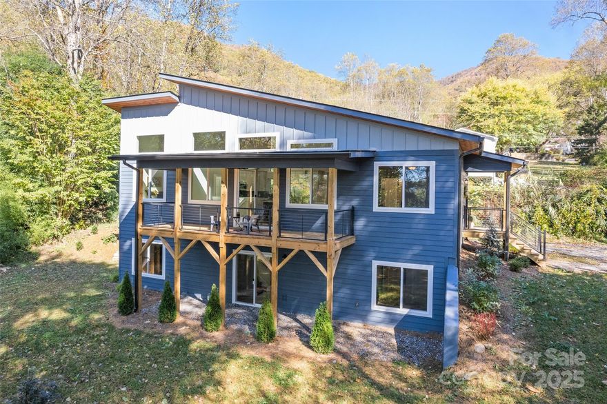 PRICE ADJUSTMENT! Discover this beautifully newly constructed 3BR/3BA home, ideally located in the sought-after Fisher Creek area. Enjoy privacy and convenience just minutes from Pinnacle Park, with easy access to Downtown Sylva, WCU, and the hospital. Inside, the open-concept layout is filled with natural light, large windows, quartz countertops, and a gas fireplace. Enjoy cozy evenings by the fire or peaceful mornings on the covered front porch, listening to the soothing sounds of Fisher Creek just across the road. Additional finished living space is perfect for a recreation room, home gym, or guest area, plus there's an unfinished room with endless potential—ideal for a workshop, studio, or extra storage. The yard features a woodland creek winding through a bamboo grove, and a wildflower/pollinator garden that blooms each spring on the south side of the driveway. Built with care, this home includes a Brown Haven Homes builder’s warranty through March 2026. A serene mountain retreat with modern comforts—don’t miss it!
