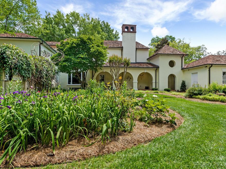 Incredible opportunity to live on one of Charlotte's most desirable streets. This stunning estate boasts over 1.7 acres, beautifully maintained gardens and an expansive home with a detached studio. The gardens behind the gates of this beautiful property have been meticulously cared for and give a peaceful, private setting just minutes from Uptown. This property is a perfect opportunity for a new owner to make their home reflect their personal style.