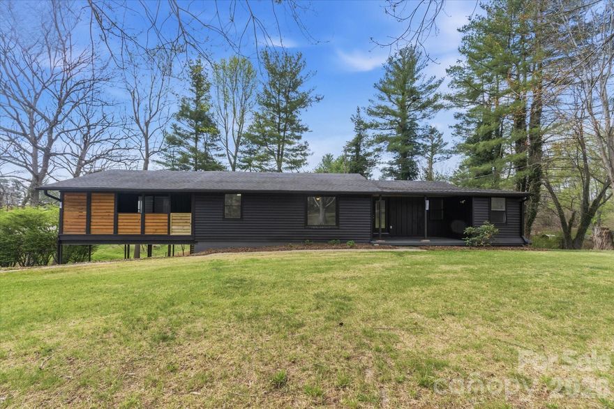 Welcome to 75 Old Macedonia Road—a classic mid-century ranch tucked on a quiet, pastoral street just outside the sought-after Olivette area, offering the perfect blend of privacy, convenience, and potential. Located just 15 minutes to downtown Asheville and a short drive to West Asheville, this property puts you close to vibrant dining, shopping, and everyday essentials while still enjoying a serene, countryside feel.

Set on a sunny, level 0.46-acre lot, the property is dotted with mature trees and surrounded by higher-value homes—an ideal canvas for gardening, outdoor living, or future enhancements. The setting feels peaceful and private, with no HOA restrictions.

Inside, the home offers 1,600+ square feet of main-level living with solid bones and timeless character. Natural light fills the space, highlighting features like shiplap accents and an open living area ready for your vision. The spacious eat-in kitchen includes a walk-in pantry and easy access to the covered porch—perfect for indoor-outdoor dining and entertaining.

With 3 bedrooms, 2 full baths, and an unfinished walk-out basement, there’s ample opportunity to expand, customize, or create additional working spaces. Whether you’re looking for a primary residence, investment, or renovation project, this home delivers flexibility and long-term upside in a highly desirable location.

A rare opportunity to create something special just minutes from Asheville—bring your vision and make it your own.