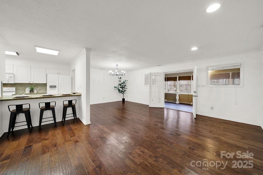 This spacious, newly updated 3 BR/2 BA ranch townhome, end unit is ready for it's new owner. Nice open floorplan concept for easy entertaining and convenient 1 level living. All appliances included. Just pack your bags, this place is turnkey! The sunroom is fully enclosed (heated/cooled) adding additional living space, with a nice serene view of the wooded backyard. Sunroom also has newly installed LVP flooring for versatile use. Updated cabinets, hardware, paint throughout, etc. N'hood features an outdoor in-ground pool. All this located just 1 mile from downtown Fort Mill, and in Fort Mill's award winning school district.

This property would make a great primary residence or investment property! This home is ready for it's next owner! Book a showing today!