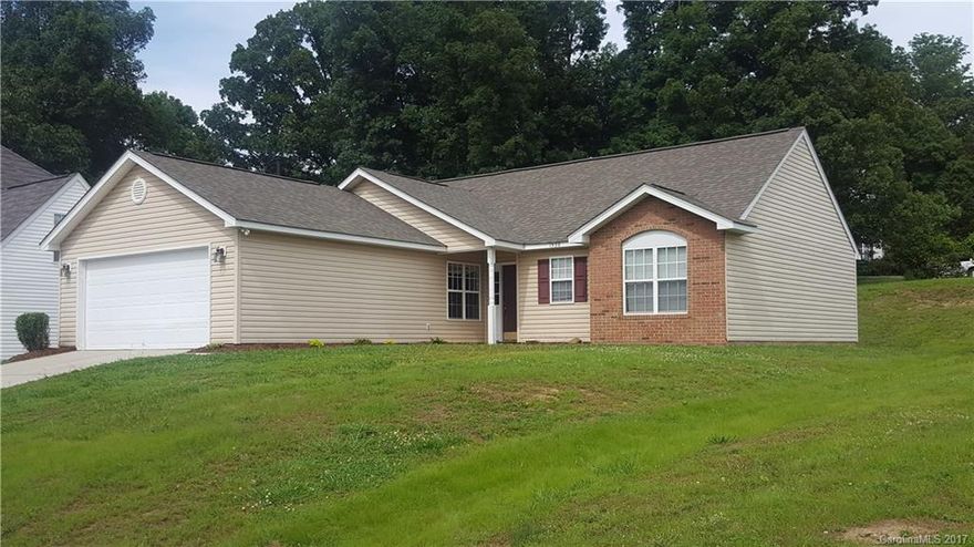 Move in ready, NEW HVAC, NEW carpet, NEW vinyl in kitchen and baths, fresh paint, fireplace with gas logs, 2 car garage, cathedral ceilings, roof in 2014, large corner lot, close to shopping, restaurants and schools.  MUST SEE!