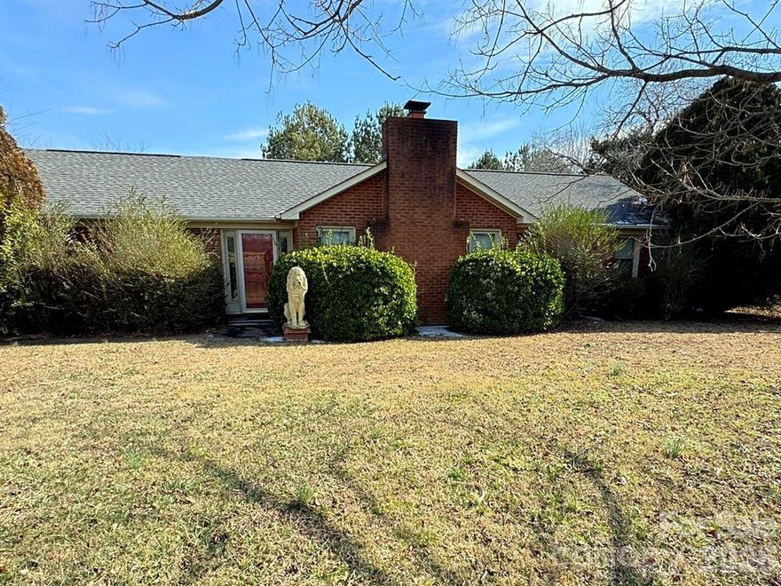 We have multiple offers. The seller has requested highest and best by Saturday Feb. 7 at 4pm. Brick ranch on nearly an acre of private land in a top rated school zone—an opportunity that doesn’t come around often. Built in 1977, this home offers 3 bedrooms, 2 bathrooms, and a bonus/sun room, plus peace of mind with a 2024 roof and 2023 heat pump already in place. Enjoy a vaulted living room that adds volume and character, ready to be reimagined with your updates. This home features an oversized 2-car garage and a separate brick workshop, offering plenty of space for hobbies, storage, or future expansion. This home has been loved and lived in and is being sold as-is, making it a great fit for buyers ready to renovate and build value. Surrounded by beautiful homes and conveniently located near grocery stores, restaurants, and shopping—walkable access (please note the road is busy). Tons of potential in a sought-after area—bring your vision.
