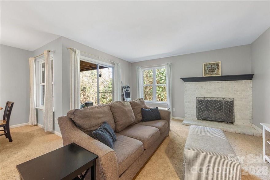Tucked away in a quiet, tree-lined community, this charming ground-level condo offers comfort, privacy, and unbeatable convenience just minutes from everything Charlotte has to offer. Featuring two generously sized bedrooms, each with its own full bathroom, this thoughtfully designed layout is perfect for roommates, guests, or a home office setup. The kitchen is both stylish and functional with granite countertops, a glass tile backsplash, pantry, and an adjacent dining area ideal for everyday meals or entertaining. Unwind in the spacious living room, highlighted by a cozy fireplace with a painted brick surround that adds warmth and character. Sliding glass doors open to a private, covered back patio with a storage closet and peaceful wooded views, the perfect spot for morning coffee or relaxing evenings. Residents enjoy access to a community pool and a location that can’t be beat. Convenient to Uptown Charlotte, Plaza Midwood, NoDa, and the Kilborne District Park with its playground, picnic shelter, and scenic trails, this home blends tranquility with urban accessibility. Whether you’re a first-time buyer, downsizing, or looking for a low-maintenance lifestyle close to the city, this inviting condo checks all the boxes. Don’t miss your opportunity to make it yours! Seller offering 1 year home warranty & washer/dryer included!