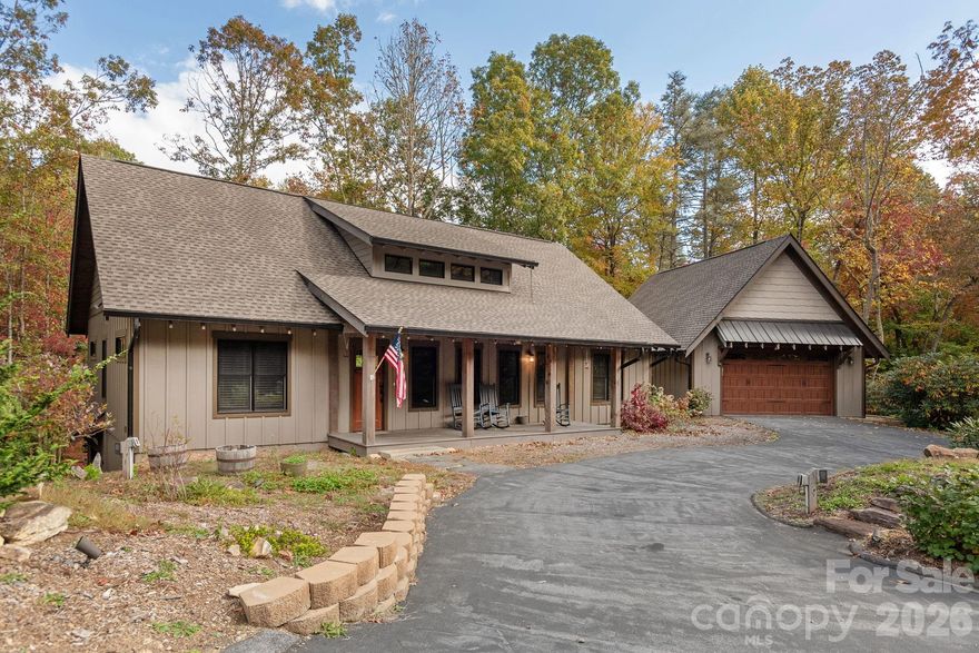 This custom-built home in Lobdell Woods offers the best of both worlds, peaceful forest living with quick access to downtown Brevard. Only 2.7 miles from Pisgah National Forest entrance and 6 miles from downtown Brevard. Just a short drive from vibrant downtown shops, restaurants, and events. The home features vaulted tongue-and-groove ceilings, granite countertops, hardwood and tile floors, a central vacuum, and a split-bedroom plan with a fun built-in bunk room behind the rock fireplace. Step onto the spacious vaulted back porch to enjoy views of the woods and creek, with a 2-car garage on the main level and a workshop below.