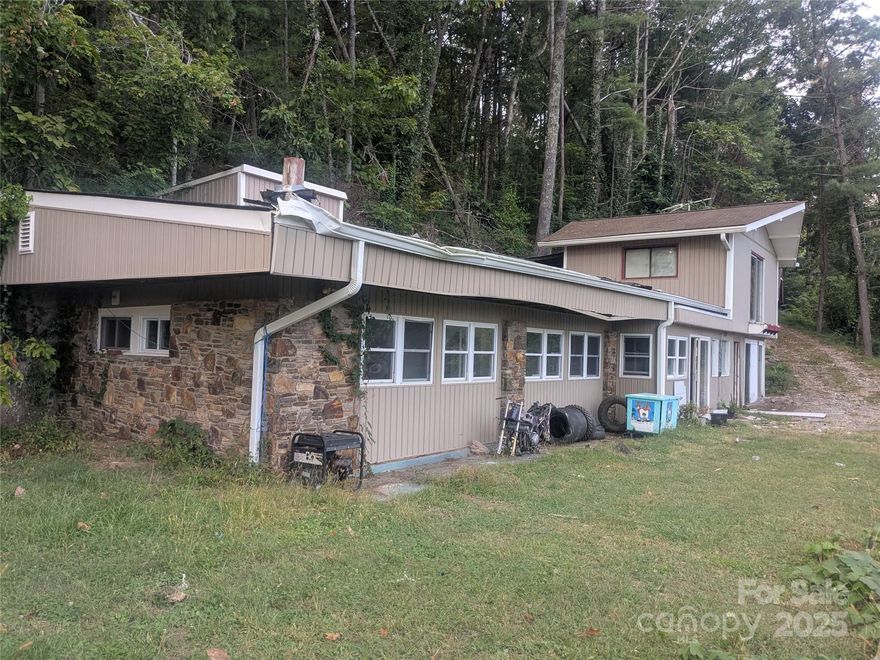 Spacious 3BR/2BA 1.5-story home with 1,161 HLA on nearly half an acre, offering gorgeous Asheville mountain views. Features include a cozy fireplace, spiral staircase leading to a private 1BR/1BA upstairs suite, and plenty of potential—perfect for investors or buyers looking to customize their ideal mountain retreat.

All contracts/offers subject to final review and approval by seller. Not binding until fully ratified by all parties. All offers.

Seller Pays: Buyer uses Premium Title Services, covering title insurance/search and escrow/settlement fees—saving buyers ~$1,660.