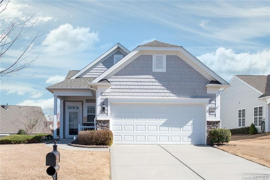 Lovely Fox Run model with sunroom situated on a huge lot with a side yard. This home features many upgrades  including beautiful 4" dark hardwoods throughout, ceramic tile floors in the baths, stainless steel gas appliances, granite counters in the kitchen, plus a rear deck with awning.  Experience easy living in this age 55+ active adult community.
