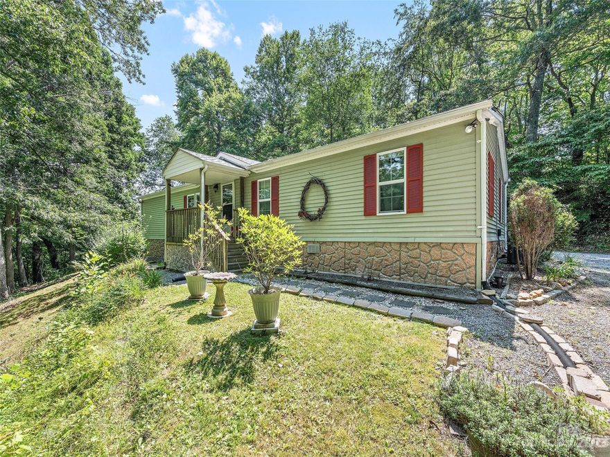 Very nice 3 bed/ 2 bath 1989 Doublewide Mobile Home. Just outside the city limits of Waynesville. Close to schools, shopping, grocery, and restaurants. Paved access and only minutes to Waynesville, Lake Junaluska and Maggie Valley. Recent updates include insulated windows, heat pump and roof. With 1620 Sq. Ft. this home has plenty of space. Comes with two storage budlings. Large wooded lot offering privacy and room for a small garden.  Court ordered sale.