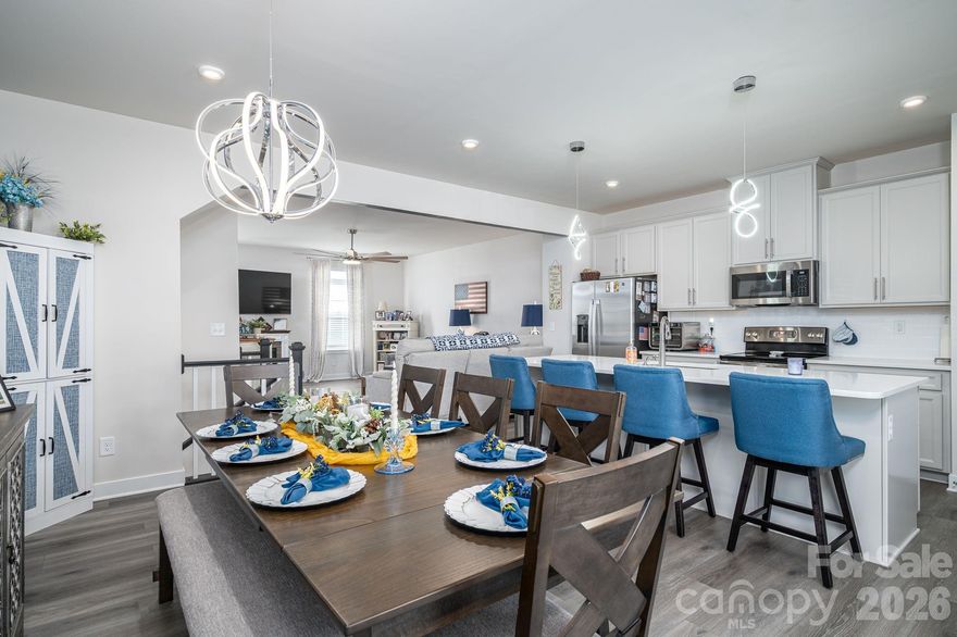 Welcome home to this beautiful, Craftsman style, 3 story townhome! Live virtually maintenance free with lawn and exterior maintenance included. Stepping inside of the main living area, you will enjoy the open concept of your chefs kitchen, your dining, and living room areas together, perfect for convenience and entertaining. The added wall, and lighting accents, along with the white quartz countertops, and kitchen island, makes for a beautiful space. The kitchen has plenty of cabinet and counter space, with sliding glass doors to the deck. Upstairs, you have all 3 bedrooms, 2 full baths and the laundry room, for extra convenience. Washer and dryer is included! The primary suite is spacious, with tray ceilings, a beautiful accent wall,  a walk-in closet, and double sinks. The first level is perfect for a rec room, or office, and has two large closets, plus the utility closet. The garage is set up for storage with ceiling racks, and the garage floor is sealed with aesthetically pleasing speckle. This home is conveniently located, close to everything in Gastonia, shopping, restaurants, Caromont Regional Medical Center, I-85, and H-74.