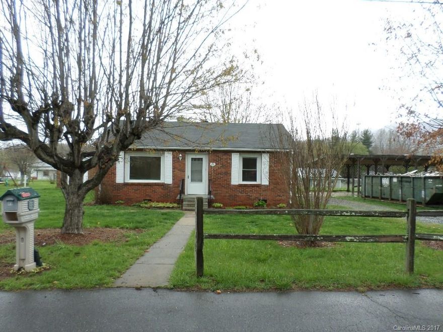 Freshly renovated!  Charming 2/1 home in town.  **House + extra lot.  Brick exterior, newly painted inside, new light fixtures and ceiling fans, updated bathroom.  HARDWOOD FLOORS.  Paved, county maintained road.  Lots of windows - light and bright inside.  Brick workshop/storage building in back yard (12'x13').  The extra lot included has a large carport (43' x 18').  The level, sunny yard provides space for your garden, pets, play area, etc.  ~~*Includes additional parcel #8605-62-4961*~~