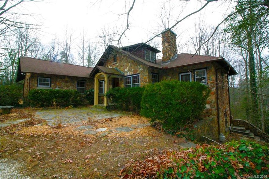 Historic 1939 stone cottage with updated kitchen and bathrooms. Home features custom wood work throughout, large living and dining area, original hardwood flooring, large stone fireplace and wood stove. Large deck overlooking property. Due to NC sqft regulations pertaining to sloped ceilings, loft 3rd bedroom and 3rd bath not included in sqft. 4th heated bedroom/bathroom in basement. Current washer/dryer in basement, but available hookups on main floor. Septic Record not found.