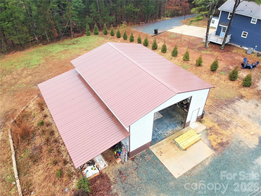 MASSIVE 30’ X 40’ GARAGE WITH HVAC NOW INCLUDED!! Lot size INCREASED to 1.07 acres!! Serene retreat close to the vibrant heart of downtown Davidson with no HOA. This beautifully updated 3-bed, 3-bath home sits on a spacious rural lot surrounded by lush trees and peaceful views, offering the perfect blend of tranquility and convenience.  Private driveway that winds through a picturesque corridor of trees. The updated kitchen is a chef’s dream, equipped with modern appliances and beautiful countertops. Covered front porch, perfect for a relaxing morning with a cup of coffee. Enjoy watching deer, turkeys, and more forage behind the home on the back porch. This home is a rare find, combining rural charm and just a few miles to downtown Davidson. Agua Pure water filtration system on private well. Easy access to shops, restaurants, and activities! So much coming to this area in Davidson soon including Summit Farms, expanding greenway to Fisher Farms, and more! See townofdavidson.org for more info.  Investors Welcome! The property can be used as a short term rental if desired. To view virtual tour, video, floor plan and more, copy & paste this link: https://media.showingtimeplus.com/sites/pnlxopo/unbranded