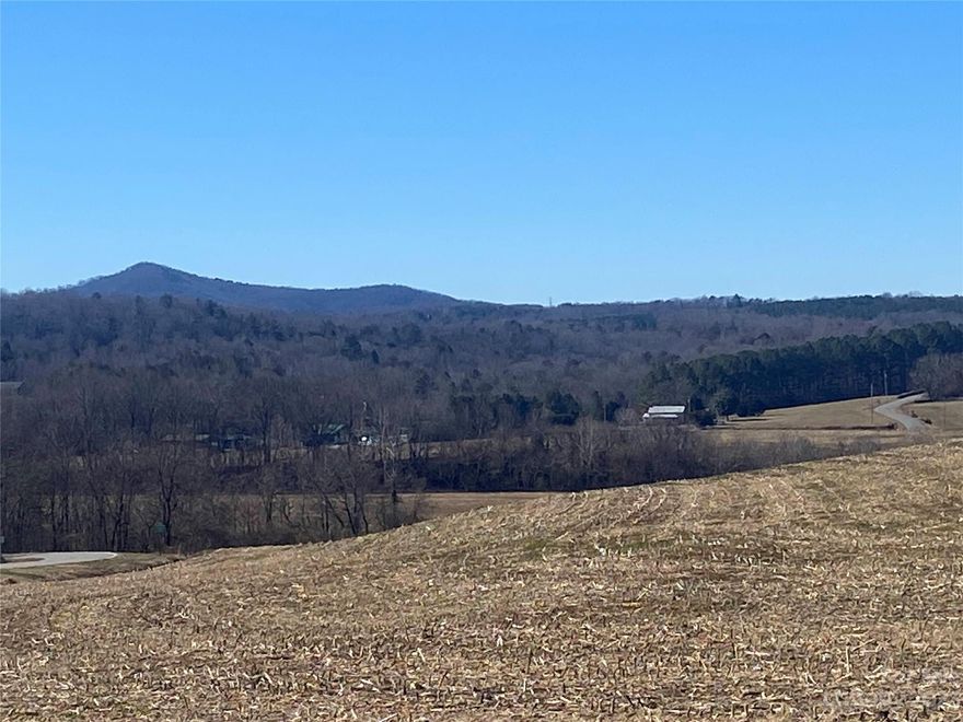 Must see this approx 6.4 ac parcel that is already cleared and ready for you to build your site built, modular or manufactured home. Property has paved road frontage and Property is part of larger parcel parcel which will be divided or you can buy entire acreage. Land has gentel slope ideal for daylight basement and beautiful long range views plus easy drive to Morganton, Marion or Lake James.