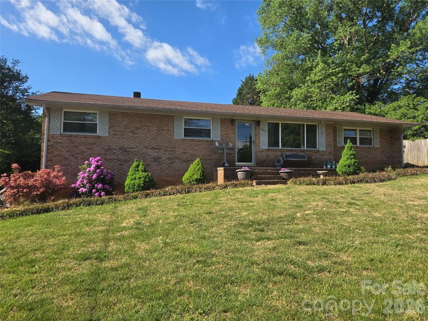 HERE IT IS! That affordable "Diamond in the rough" you have been looking for! The home has been well maintained & while move in ready, is ready for updates to fit your taste. This all-brick ranch home offers a 1.28-acre lot, unfinished basement with garage access, a LARGE detached workshop with two garage doors and a convenient location with low county taxes. Inside the home has a typical layout for its age. The main floor features a good-sized living room, eat in kitchen, large den with built ins (great for home office) and access to the rear patio, 3 bedrooms and hall bath. The home features hardwood floors in the living room and bedrooms, ceramic tile in the hall and kitchen and carpeted large den.  The open floor-plan basement has a garage door and single-entry door for access, laundry hook-ups, wood stove used as auxillary heat and plenty of space for whatever your imagination desires.  Outside you have a 1.28-acre lot, replacement double hung windows, gutter guard filters on the gutters, architectural roof shingles, large garage/shop with 2 garage doors, room for 4-plus cars and so much more. Bring your imagination and start living the dream!  Note:  the two wall mirrors in the living room are excluded from the fixtures list