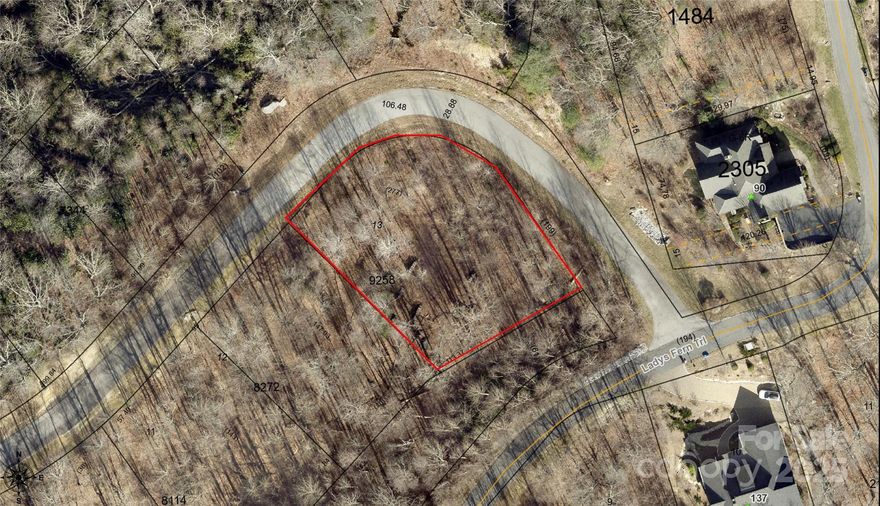 This is an easy build lot in the popular and classy community of Somersby Park. The corner parcel gives potential for great curb appeal and a stately approach.   It's location uniquely blends privacy off of Red Bud Lane, but also sits near established neighbors on Lady Fern Trail.  
Just minutes from the breathtaking views at Jump Off Rock, this property welcomes you with a beautiful gated entry off of Hebron Road into 160 private lush acres. Building here would mean your daily commute begins and ends with a drive through impressive granite rock faces and along the community's reflection pond.
Here, the sounds of the outside world fade and are replaced by the gentle rustle of leaves and the cheerful song of birds. It’s a space where you can breathe deep, unwind, and truly feel at home.  Approximately 15 minutes to downtown Hendersonville.