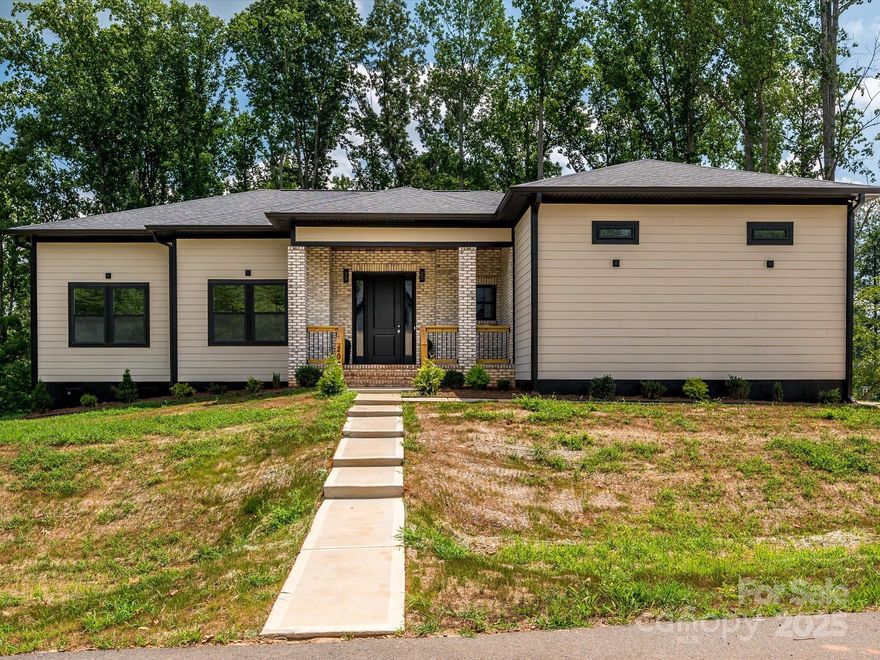Welcome home to this incredible new construction in the Bennington Estates subdivision! This home boasts amazing curb appeal with a modern design that is still charming in every way. Inside you'll find a bright and open concept with a split floor plan. The kitchen features ceiling height cabinetry with accent lighting, quartz countertops with matching backsplash, a pot filler, built in microwave, open shelving, stainless steel appliances, an induction stove top and more!! After admiring the pantry, make your way to the huge primary bedroom and bath with dual vanity sinks, a frameless shower with tile surround, and a closet that's sure to meet all your needs. The laundry is conveniently located near the primary bedroom, has direct access to the guest bath, and is functional as a mudroom. Just when you thought it couldn't get better, step out onto the beautiful rear deck and enjoy the view. Where else can you get this kind of quality at this kind of price!? Don't let this one slip away!!