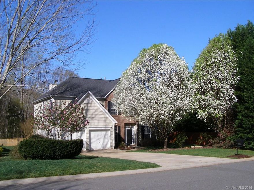 The other homes are jealous! Beautifully manicured lawn, fenced backyard w/hot tub, fire pit area and deck all overlooking private wooded back. Immaculate inside w/gorgeous Brazilian HWs thru main living areas, + upstairs BRs & hallway. Large tiled entry. Formal LR/DR w/columns & moldings. Kitchen sparkles w/granite ctrs & decorative glass tile back splash & is open to GR w/FP. Huge Master Suite & deluxe bath w/garden tub, dual sink vanity & awesome tiled shower. Bonus offers great flex space.