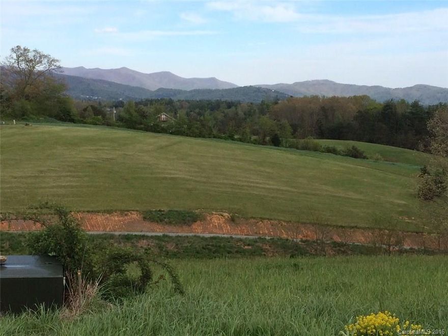 Sloped lot with beautiful long range mountain views. Also has views of neighboring pond. Underground cable and electric on lot. Approved for a 4 bedroom septic. Deed restricted development with stable HOA and more new construction being built.